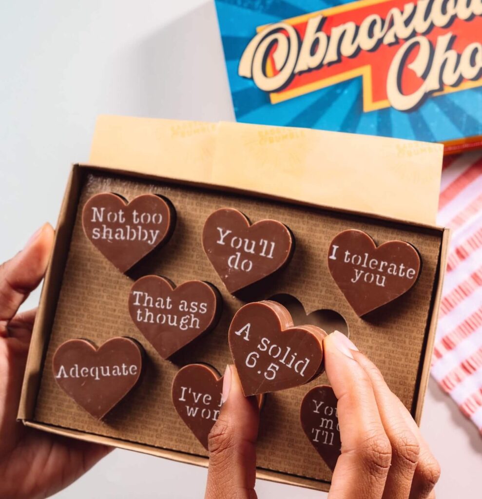 Open box of eight Obnoxious Chocs Belgian chocolate hearts